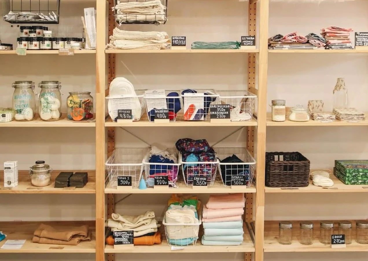 store shelves stocked with products like candles, bath bombs, and fabrics