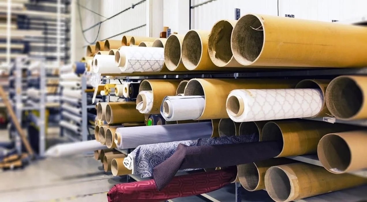 warehouse stocked with rolls of wallpaper