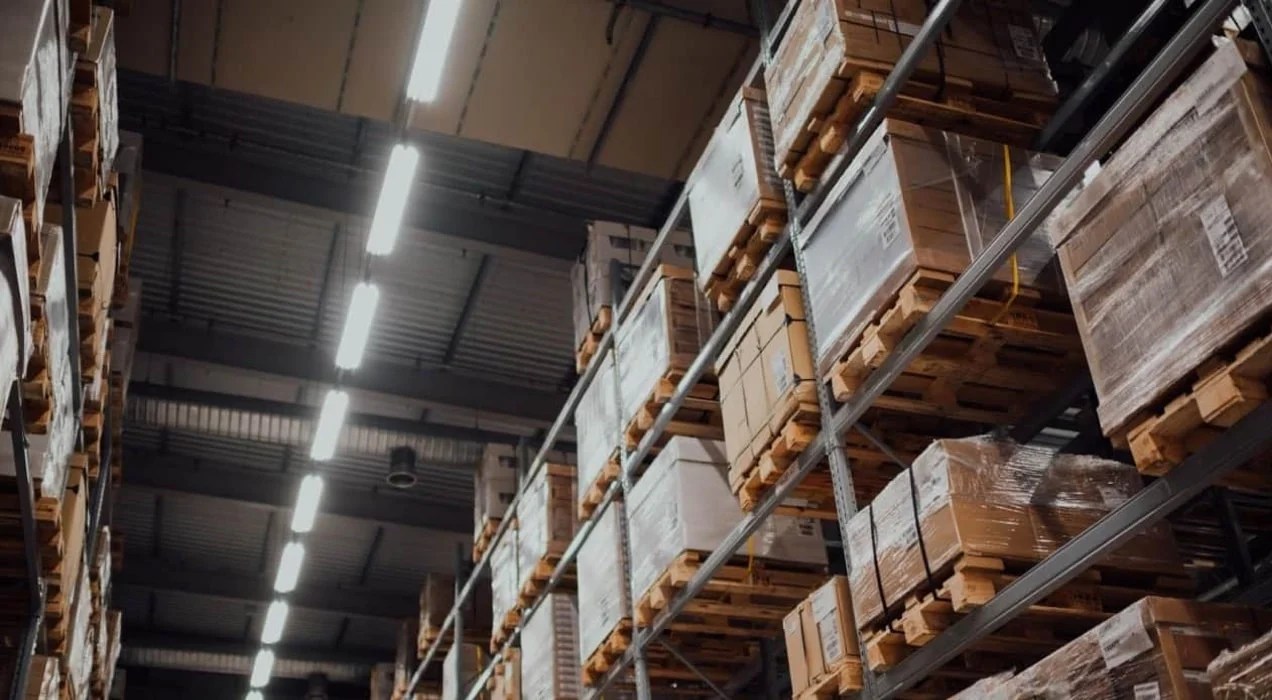 warehouse with shelves full of pallets