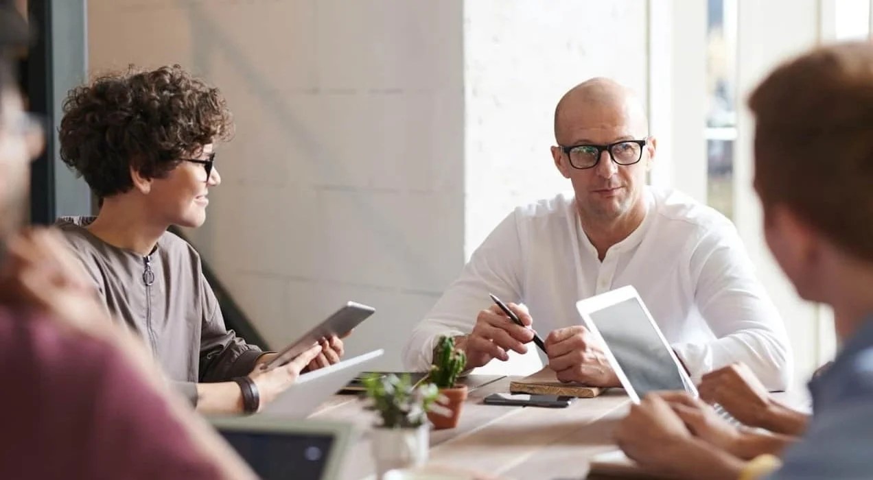 group of people meeting around a table